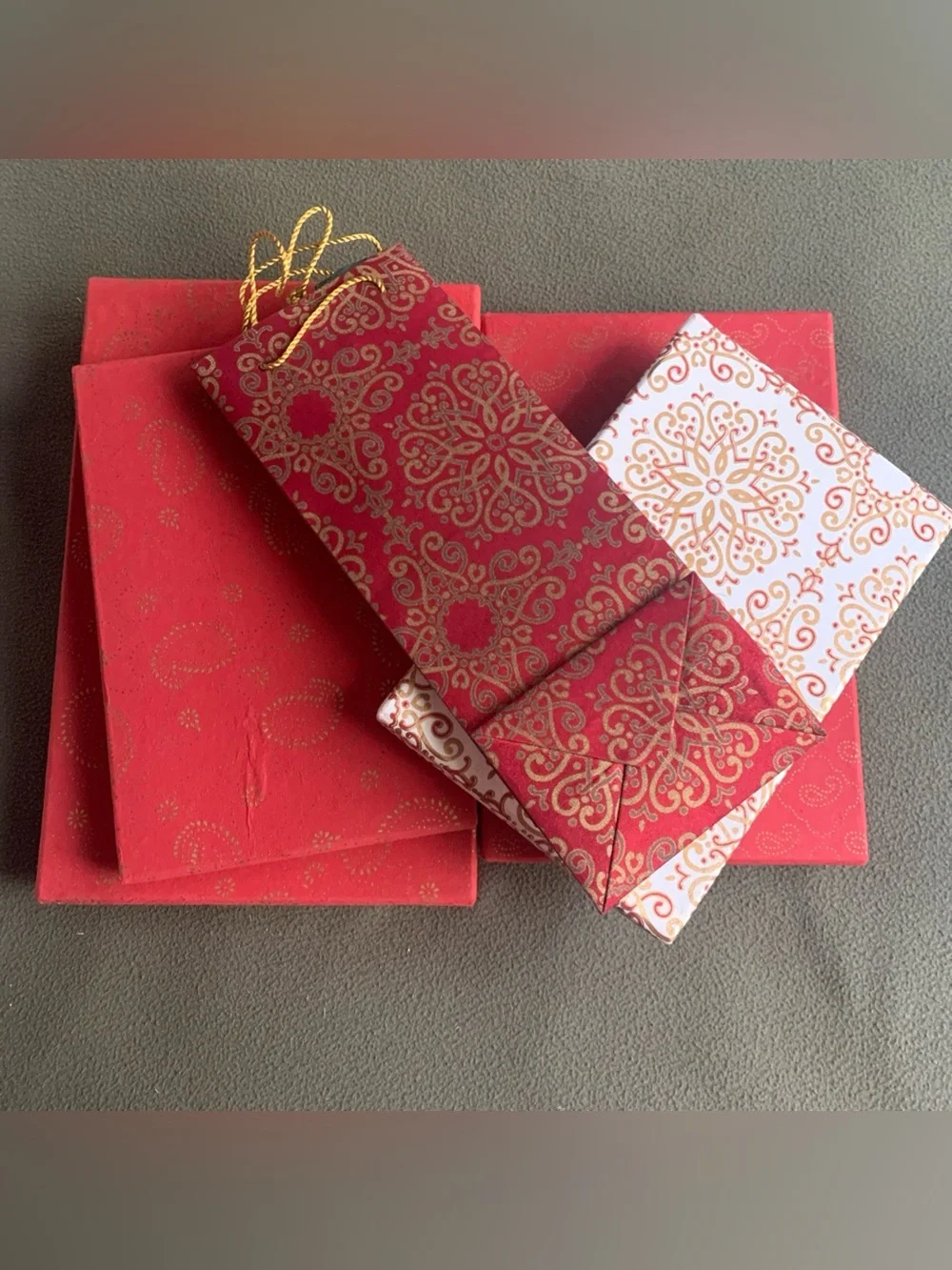 Decorative gift boxes and bag. 4 boxes, 1 bag. Red, gold, cream.